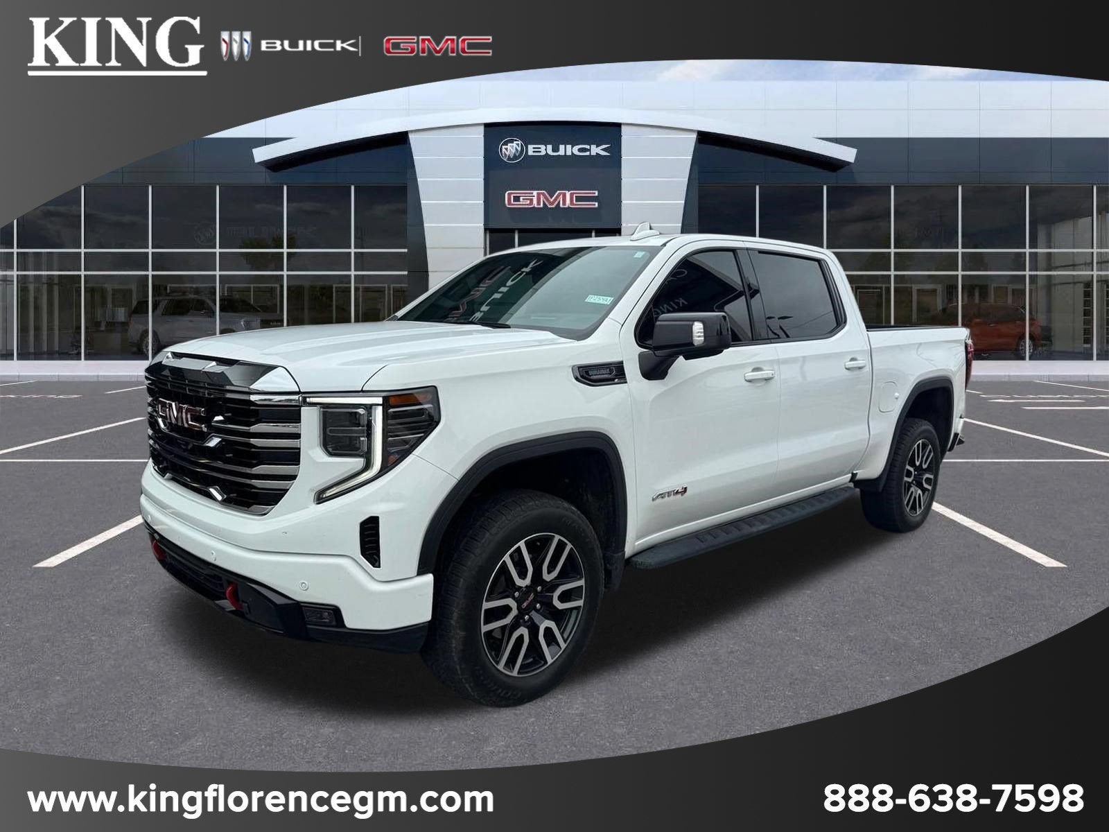 2023 GMC Sierra 1500 AT4 in Summit White — front three-quarter view